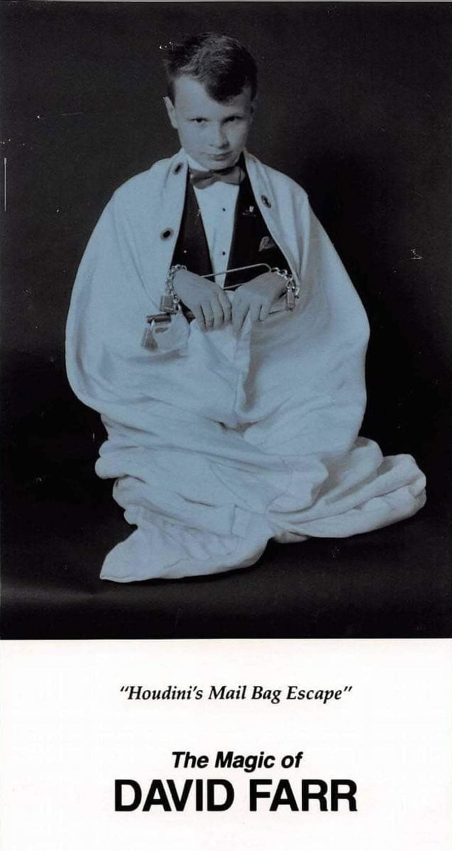 Promotional flyer showing a young David Farr in a tuxedo sealed inside a white canvas mail bag with chains and padlocks, printed with Houdini's Mail Bag Escape, The Magic of David Farr