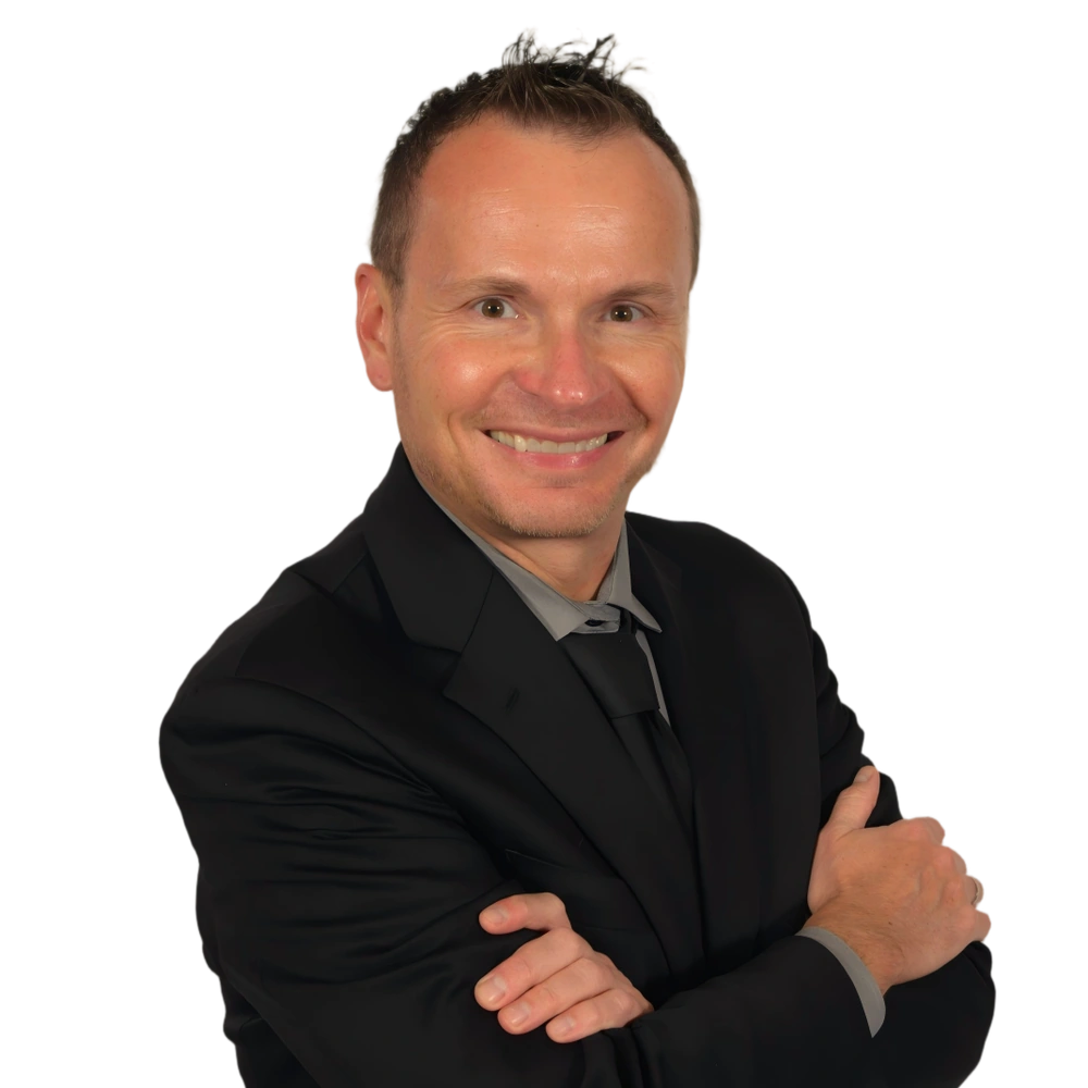 David Farr, magician David Farr, Minneapolis magician, in a black suit with his arms folded
